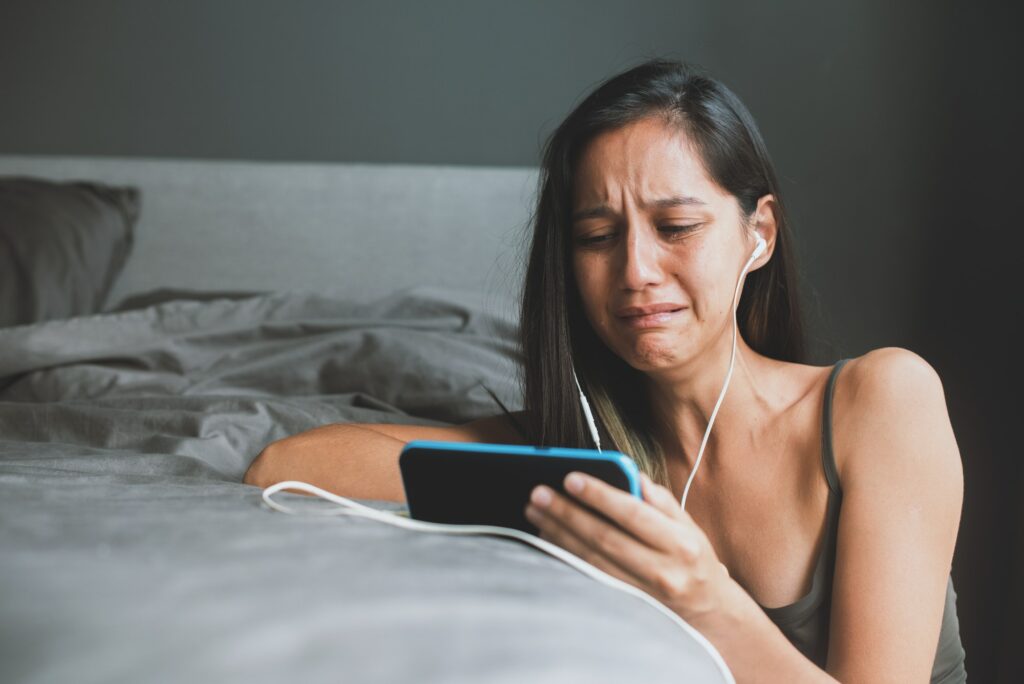 Young girl is having chat with family on smartphone