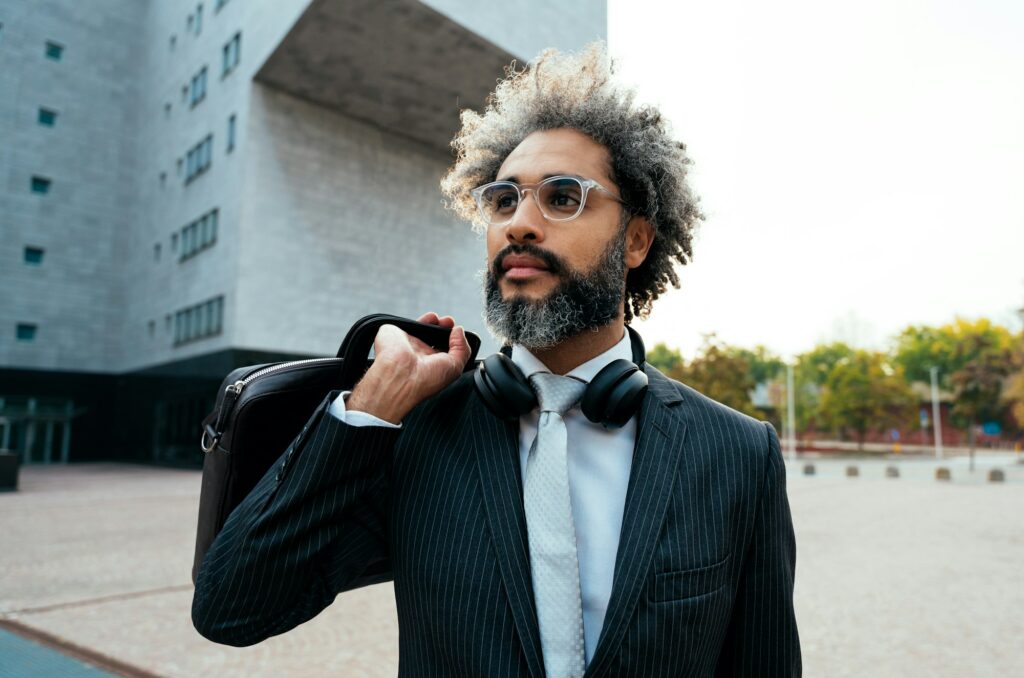 Young entrepreneur business man walking outside his office